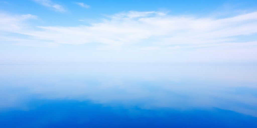 Calm lake surface reflecting the sky.