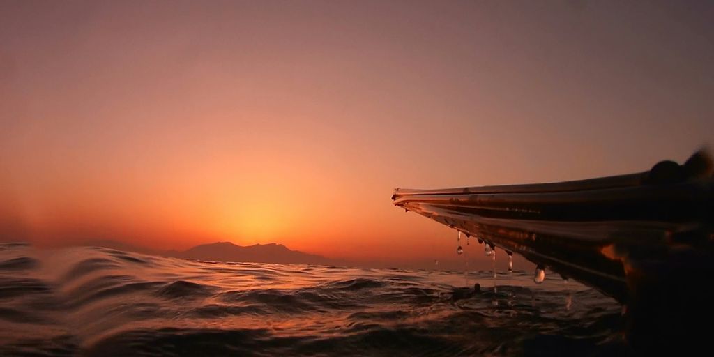 silhouette of boat and water