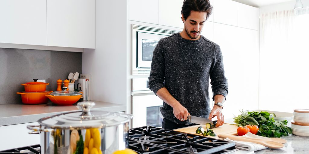 man cutting vegetables