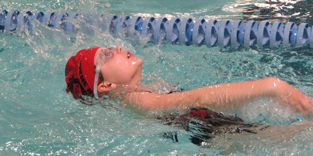 swimmer drinking water or energy drink