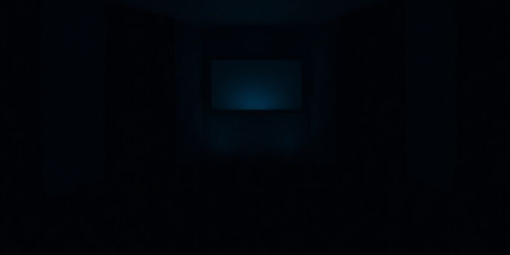 Dark, empty room with a single, glowing screen.