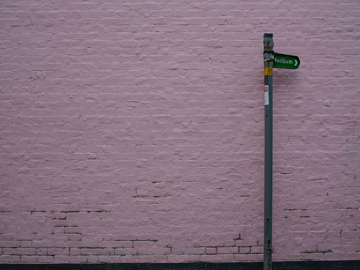 green and grey street sign