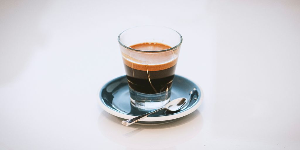 clear glass cup on saucer
