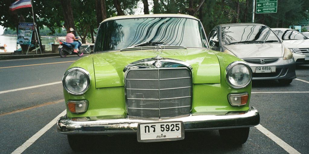a green car on the street