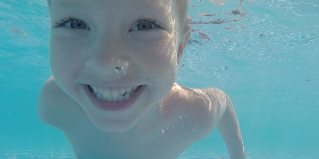 swimmer eating fruit snacks poolside