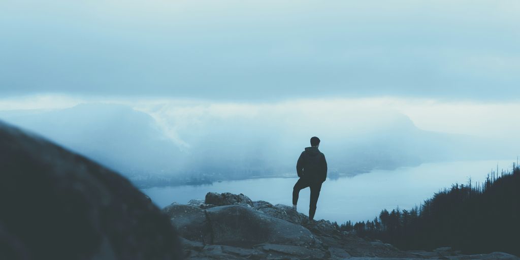 person standing on mountain