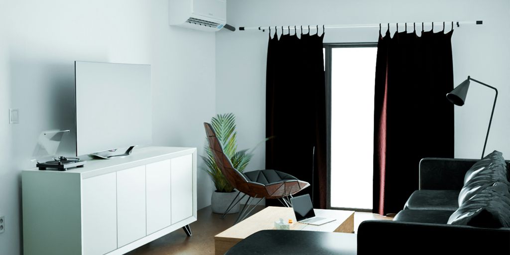 a black and white living room with a large window