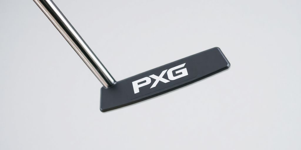 PXG putter shaft close-up with blurred golf club head.
