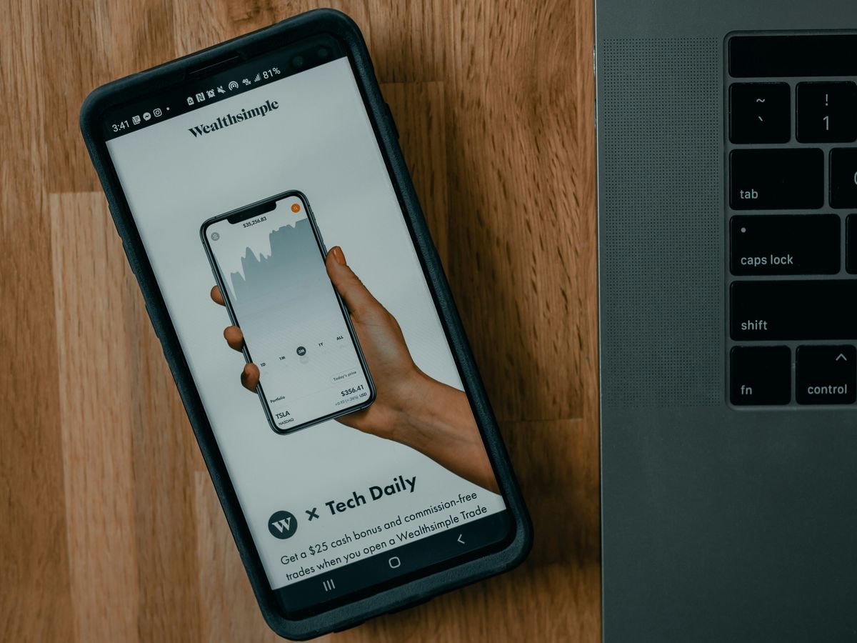 black samsung android smartphone on brown wooden table