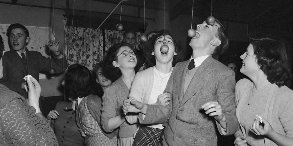 a black and white photo of a group of people dancing