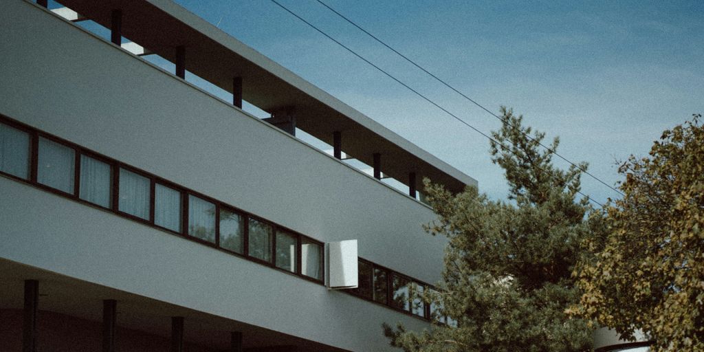 a building with a tree in front of it