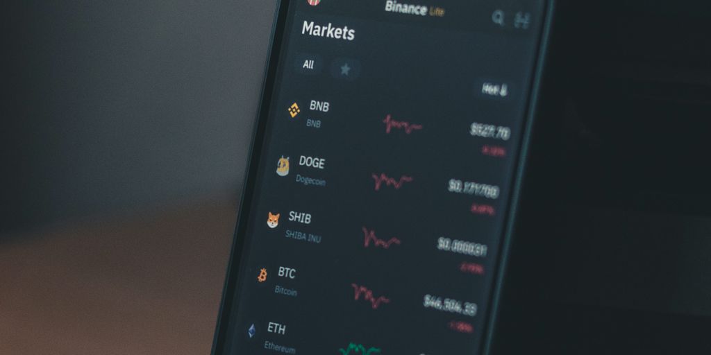 A smartphone displaying cryptocurrency market prices and trends.