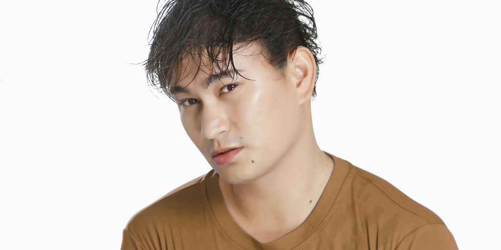 a man with a brown shirt and a brown t - shirt