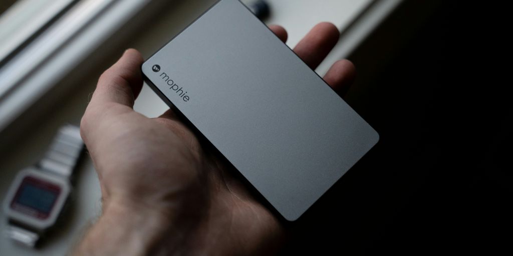 person holding white huawei smartphone