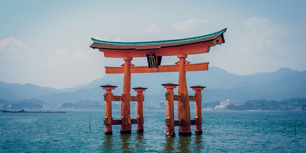 red shrine in body of water