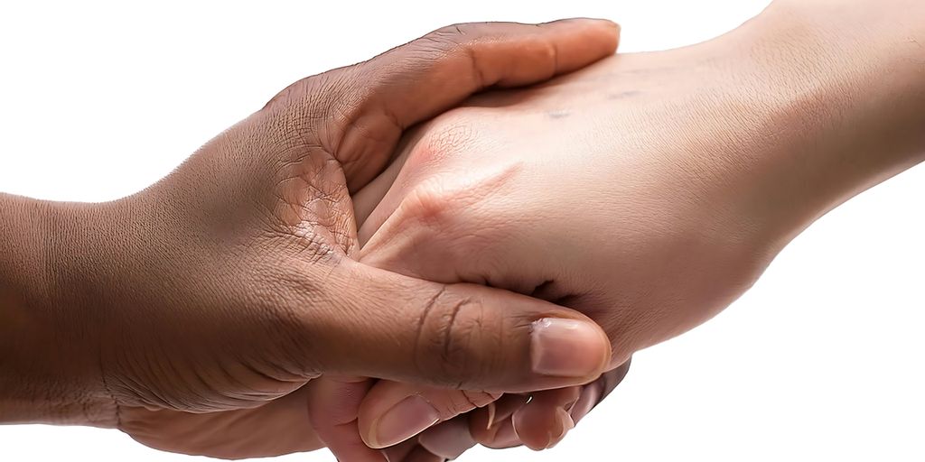 A close up of two people shaking hands