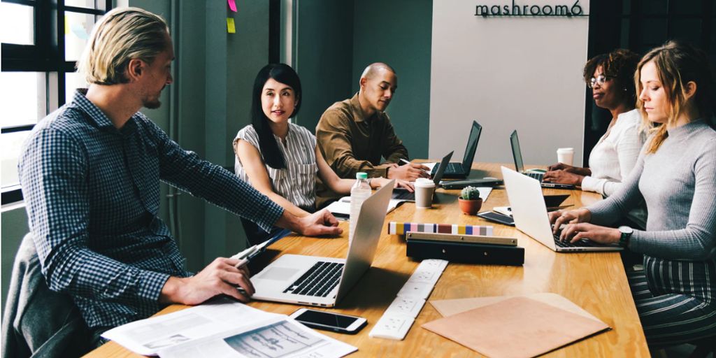 business meeting in a modern office with marketing strategy charts