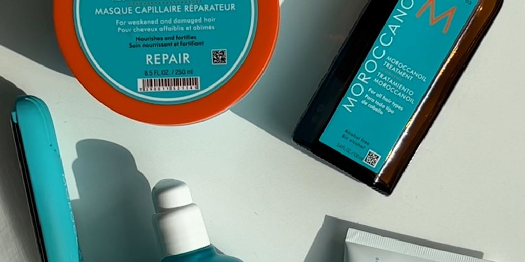 Hair care products displayed with shadows, colorful packaging, branding visible.