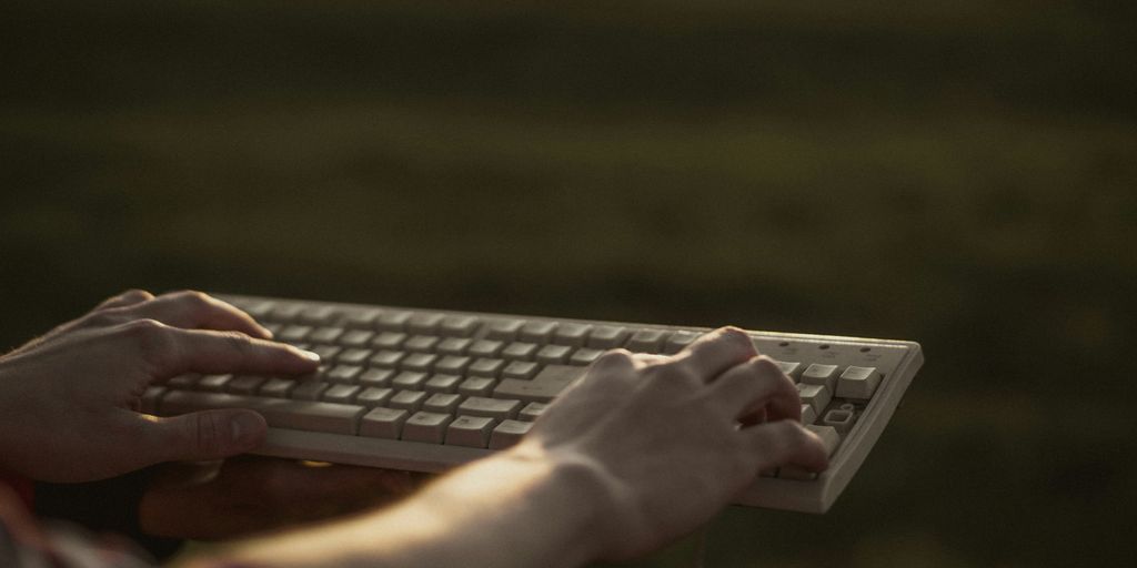 person using black and gray computer keyboard
