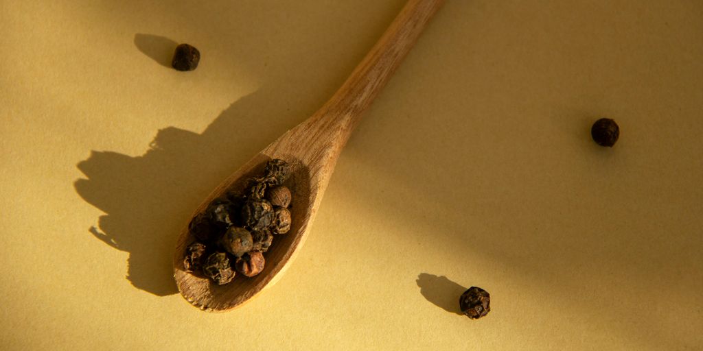 brown wooden spoon on yellow textile