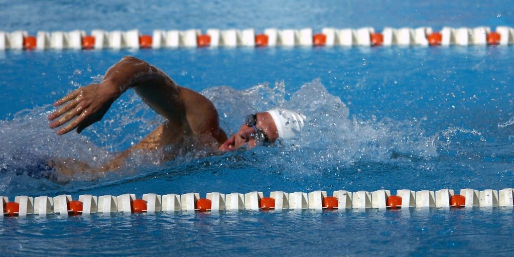 swimmers eating healthy snacks poolside