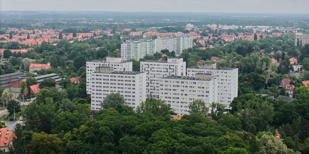 High-rise buildings and greenery in an urban landscape.