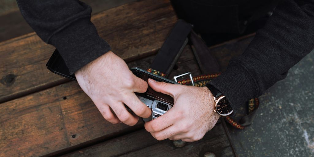 person holding film camera