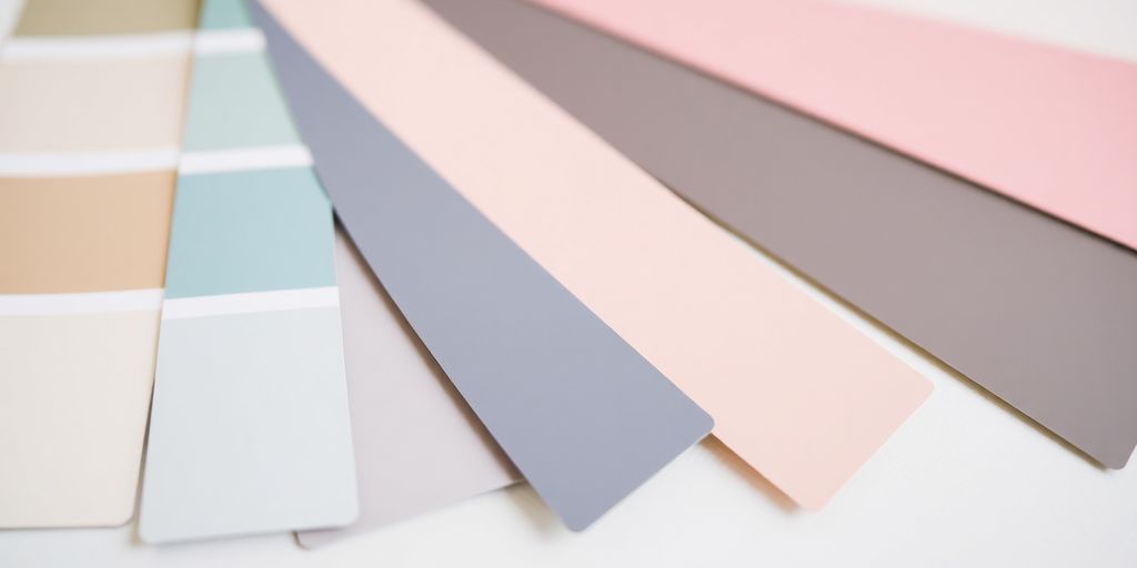 Monochromatic paint samples in various shades on display.