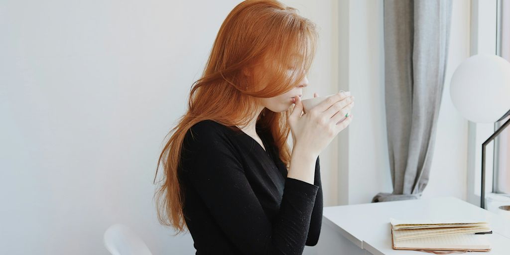 woman in black long sleeve shirt sitting on chair