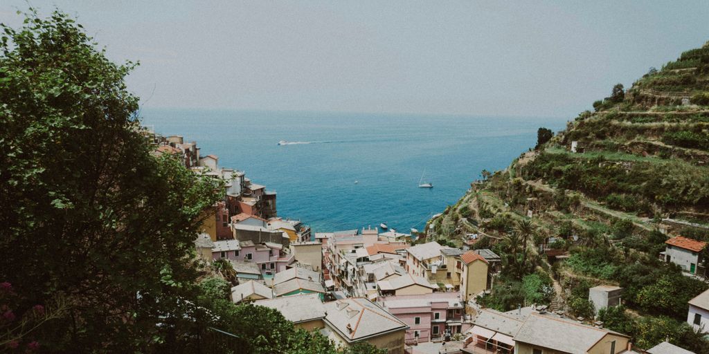 a view of a village on the side of a mountain