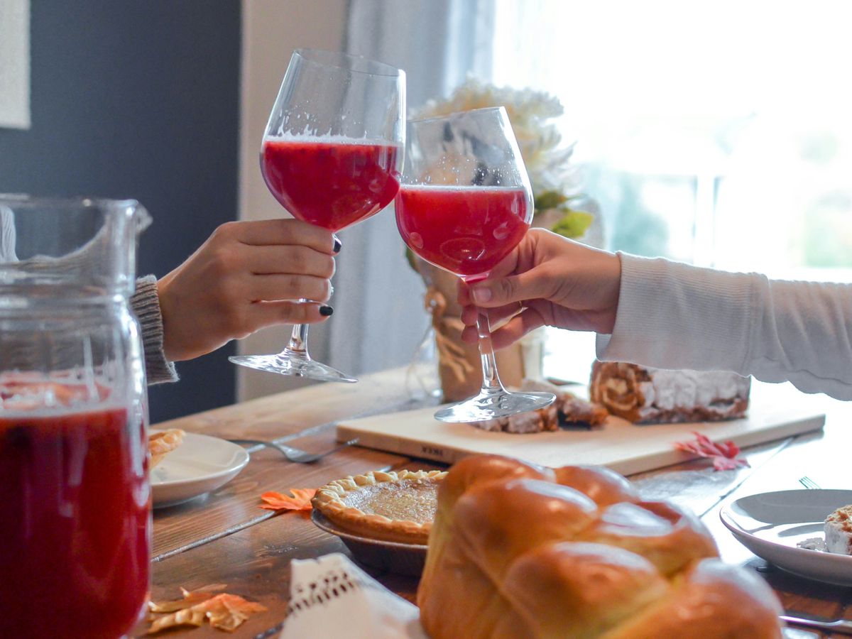people toasting wine glasses