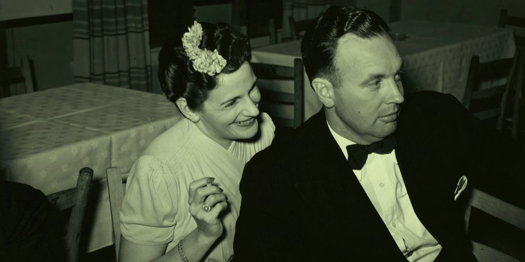grayscale photography of man and woman