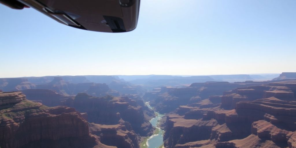 A helicopter flying over the vast Grand Canyon gorge.