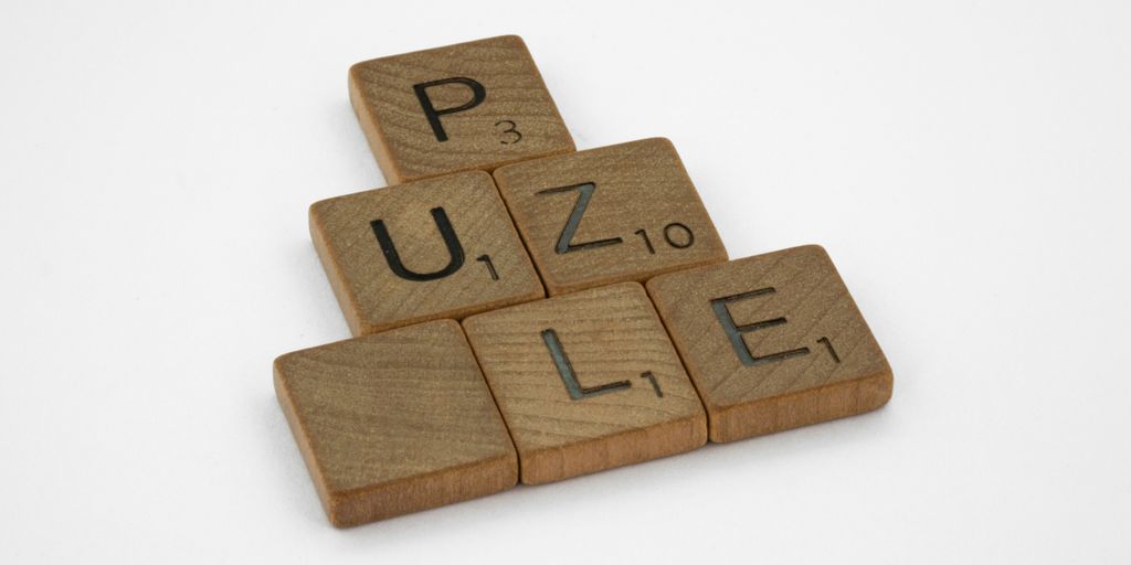 brown wooden number 2 on white surface