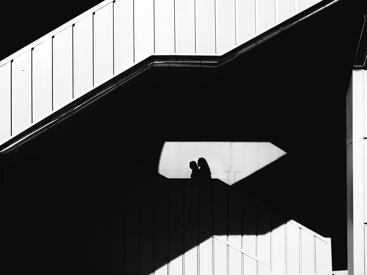 A black and white photo of a person on a skateboard