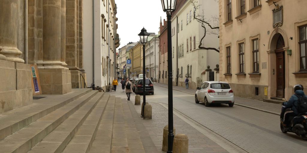 A city street view with buildings and cars.