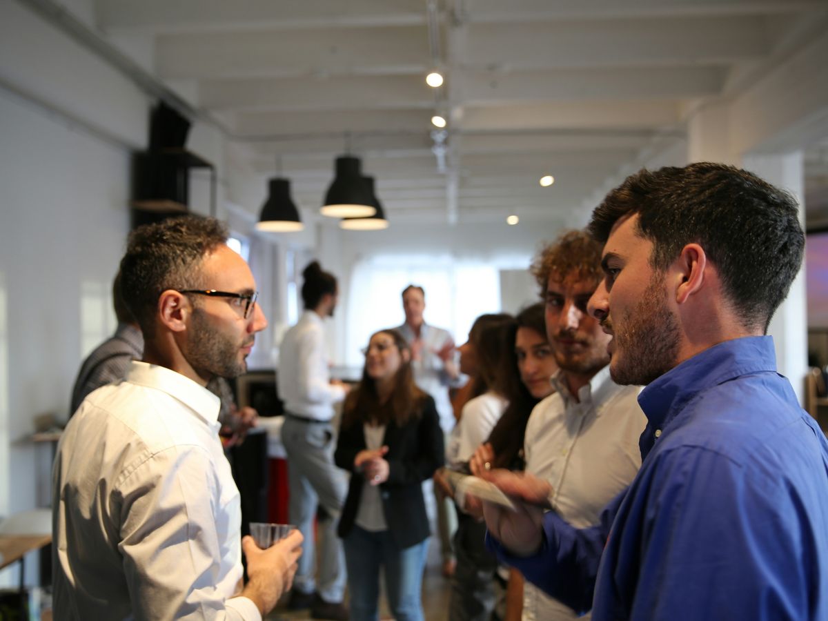 a group of people standing in a room