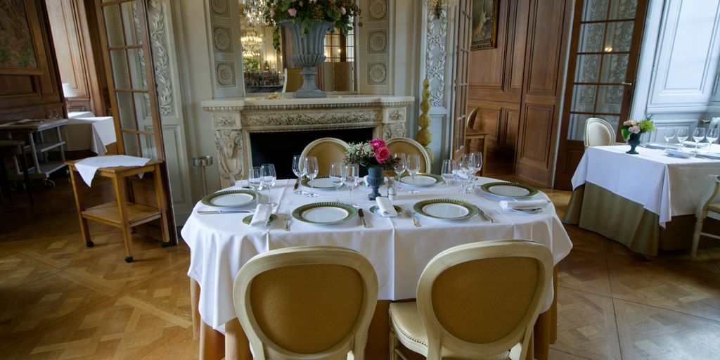 a dining room with a table set for four