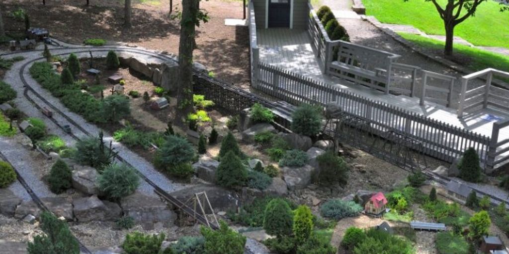 lush garden with diverse plants, showcasing companion planting techniques, seasonal flowers and vegetables, vibrant and healthy growth