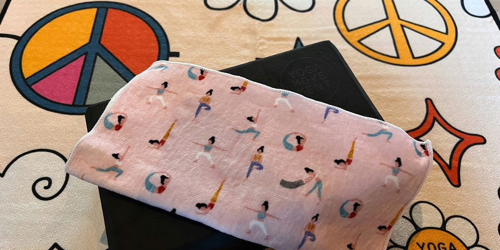 a pair of yoga mats with peace signs on them