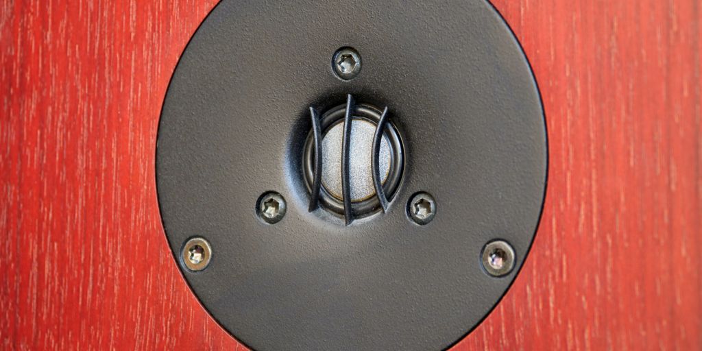 black round metal on red textile