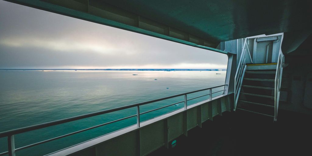 A view of the ocean from inside a boat