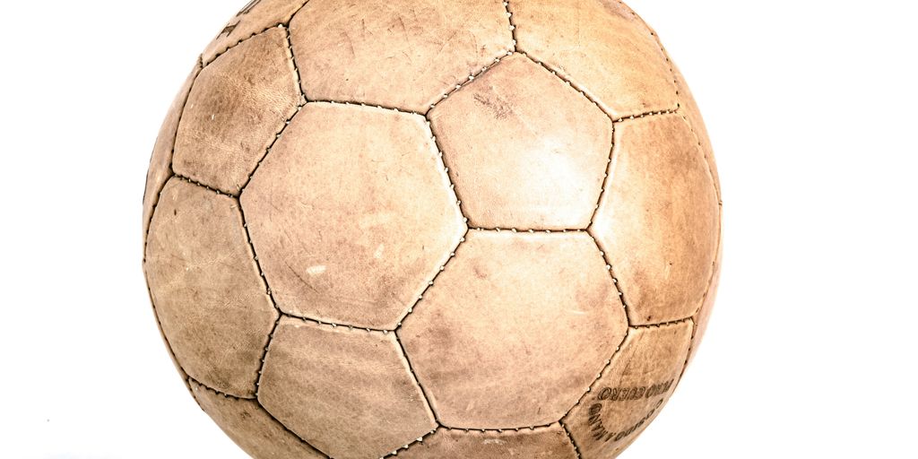 a brown ball with a white background