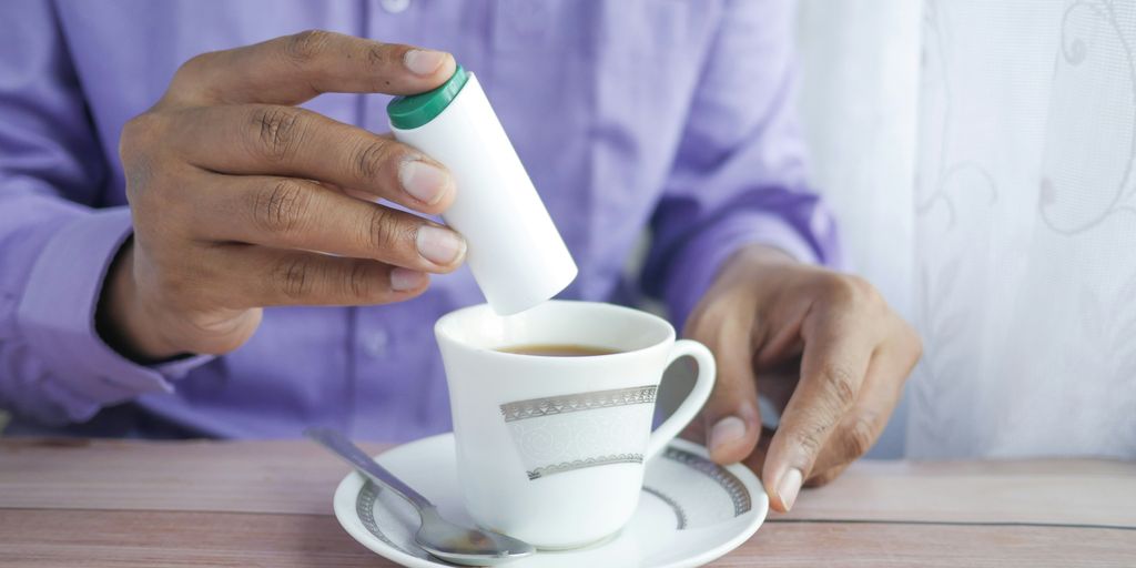 person holding white ceramic mug