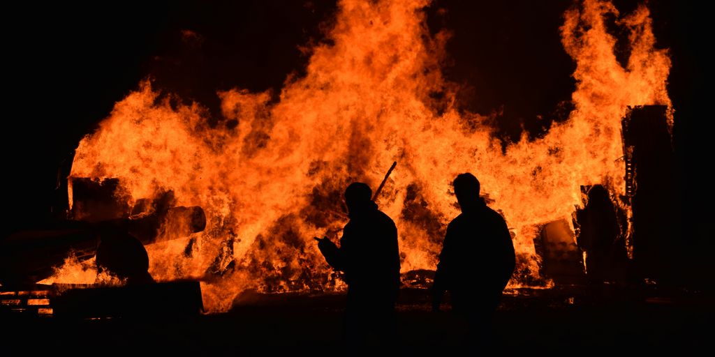 people walking near fire