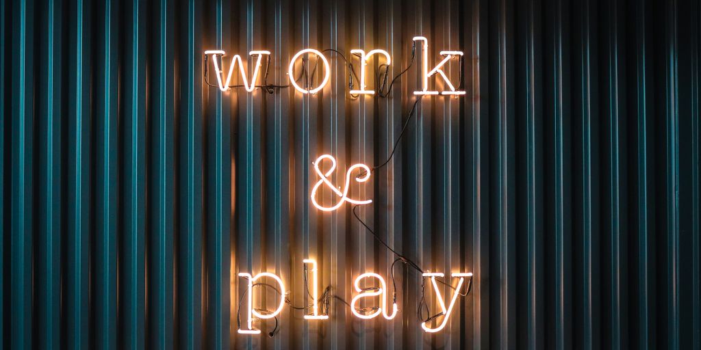 Work and Play yellow neon sign