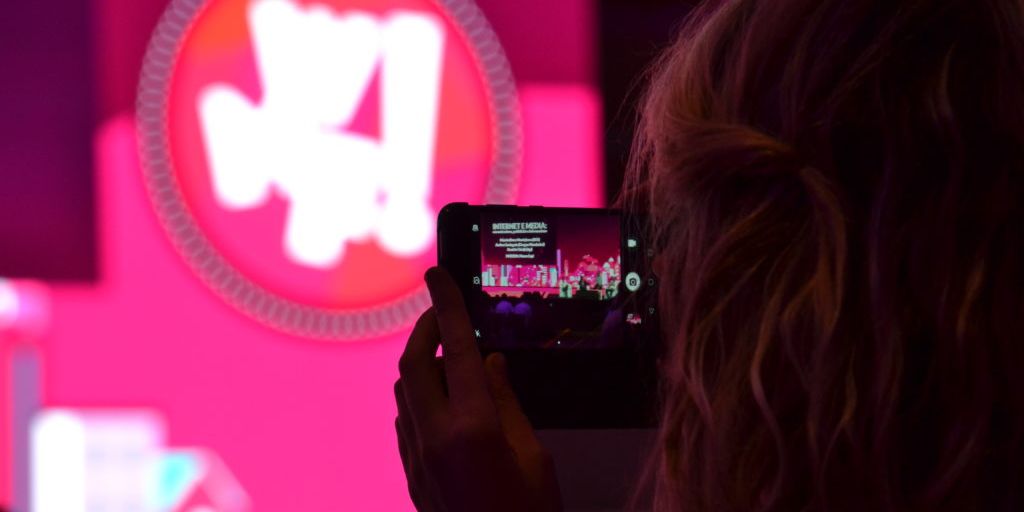 person adjusting privacy settings on social media with a digital lock icon