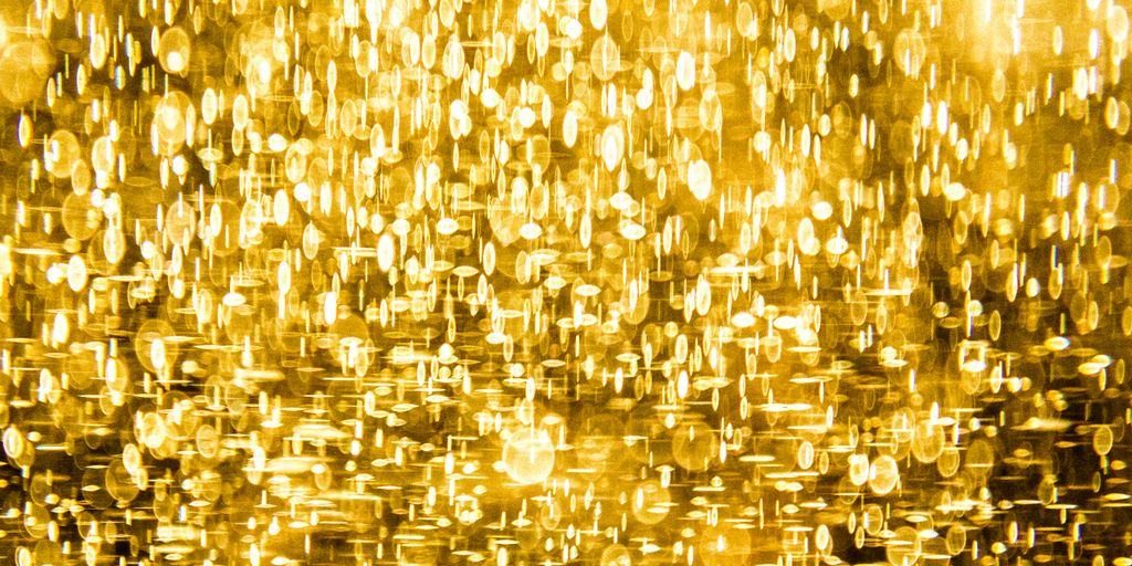 a yellow background with lots of small circles