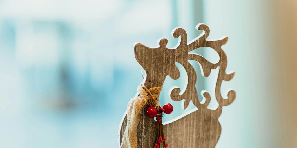 brown wooden carved reindeer decoration on table
