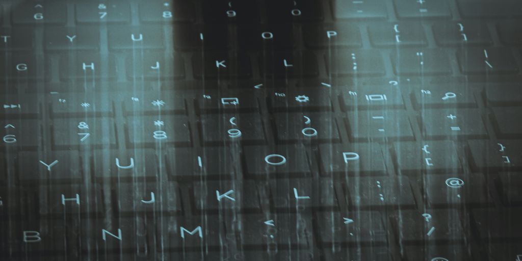 A computer keyboard with a sky background